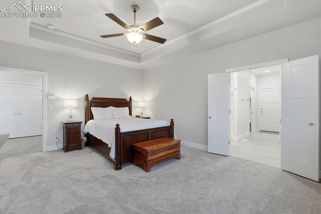 Image 20 of 49: The primary bedroom has an ensuite bath and lots of natural light.