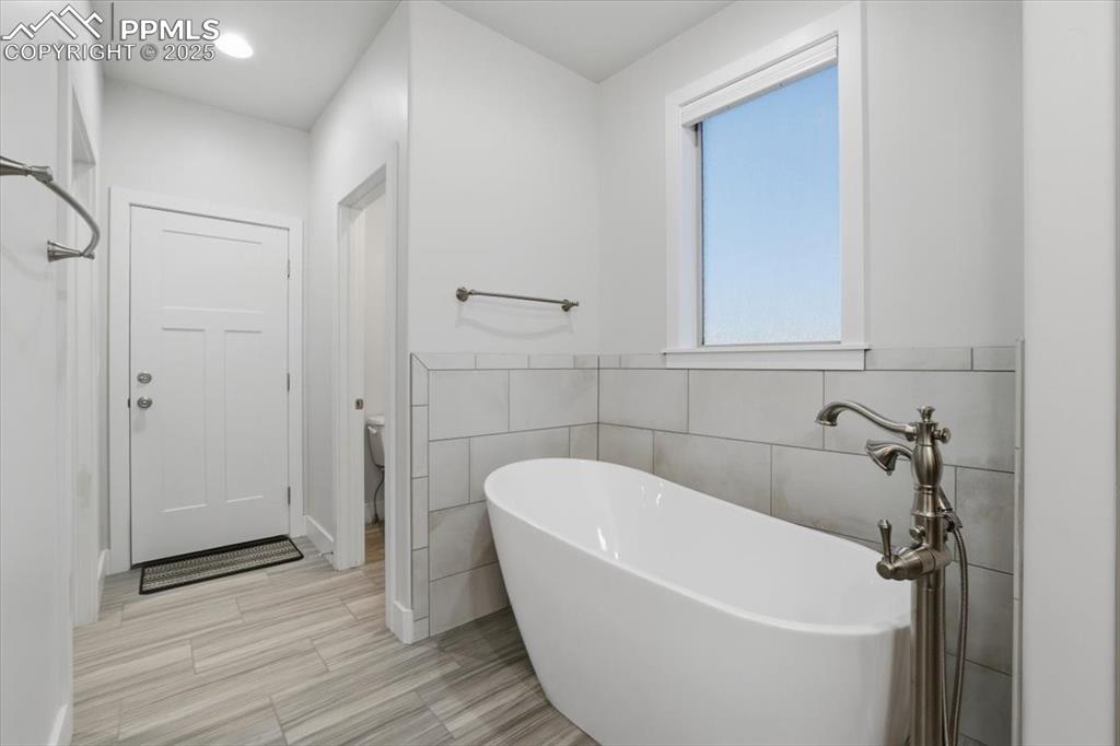 Image 25 of 49: The primary bathroom is beautiful and elegantly finished, the perfect place