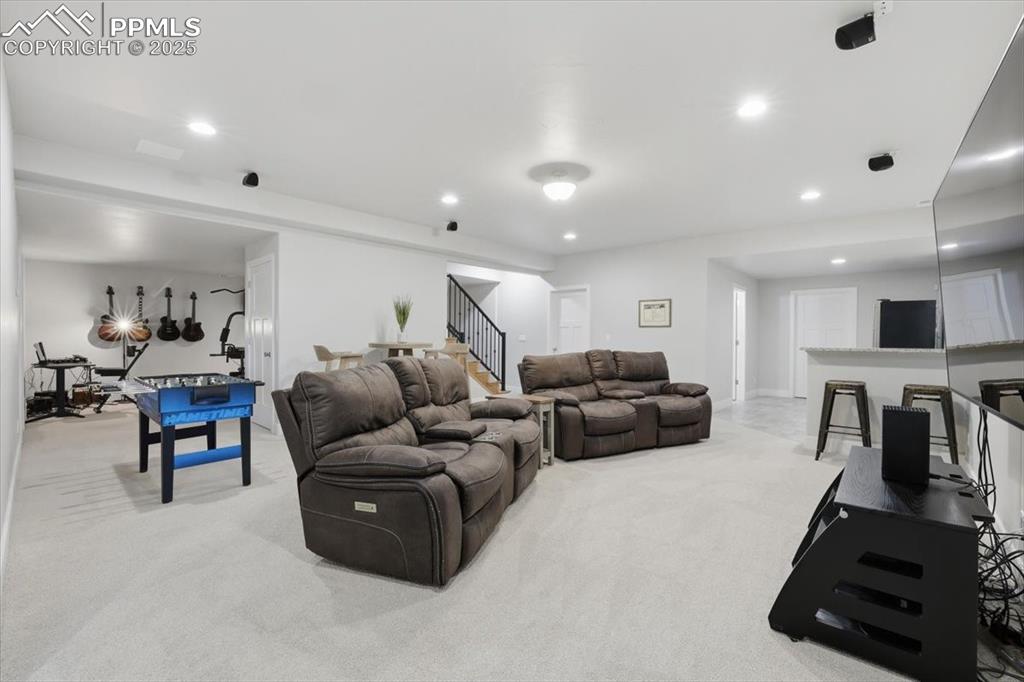 Image 36 of 49: The basement family room is spacious and inviting.