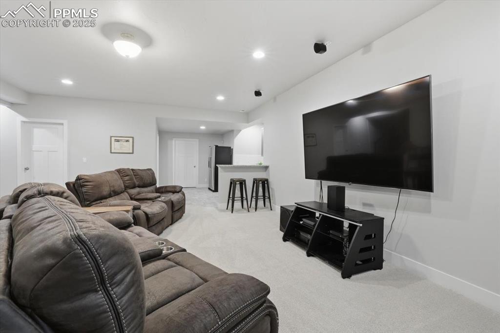 Image 37 of 49: The basement family room is the perfect hang-out space.