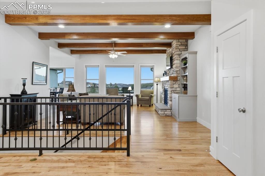 Image 8 of 49: Beamed ceilings and hickory floors are just some of the details you