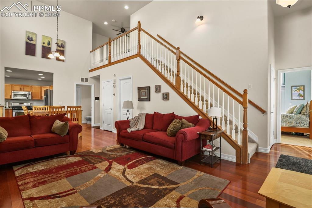 Image 16 of 41: Additional view of family room, shows main level Primary bedroom & stairway