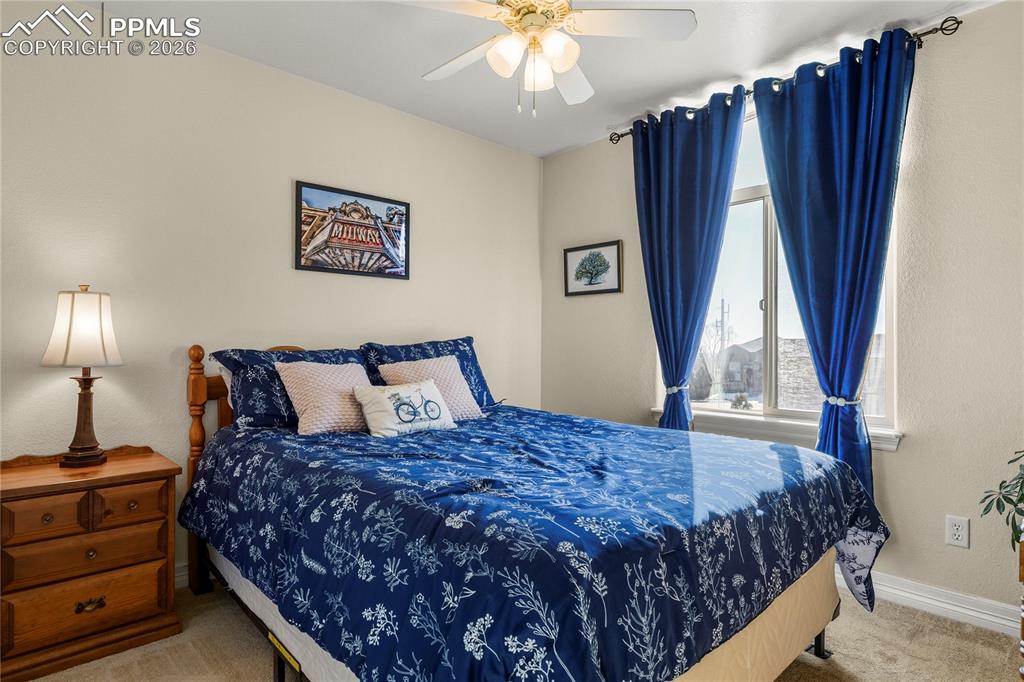 Image 32 of 41: Upper level 2nd bedroom with walk-in closet.