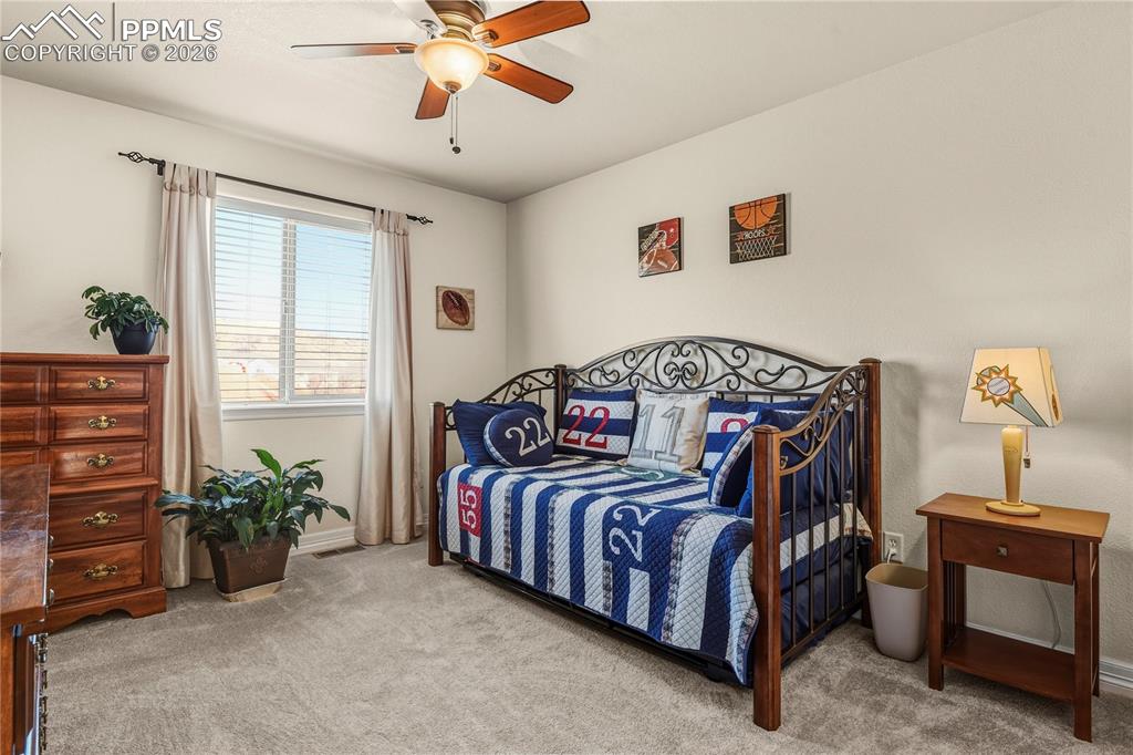 Image 34 of 41: Upper level, bedroom 3. New carpeting & walk-in closet.