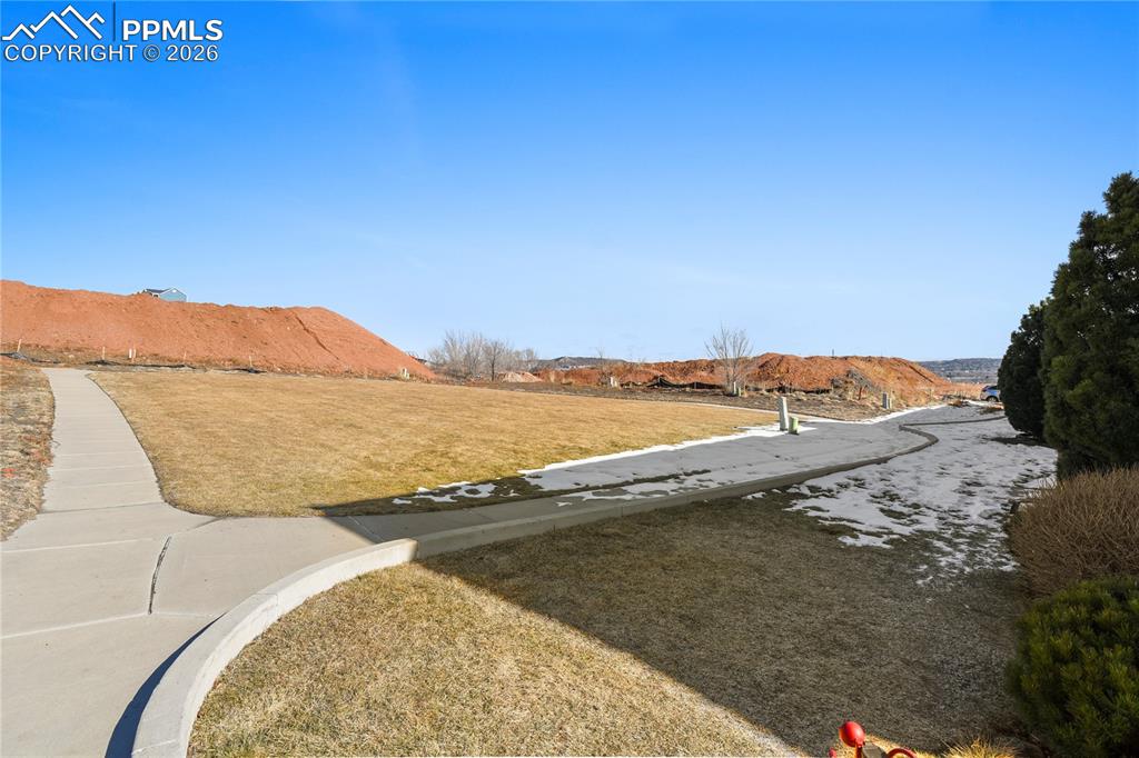 Image 9 of 41: Play area,dog walking path directly behind this home.