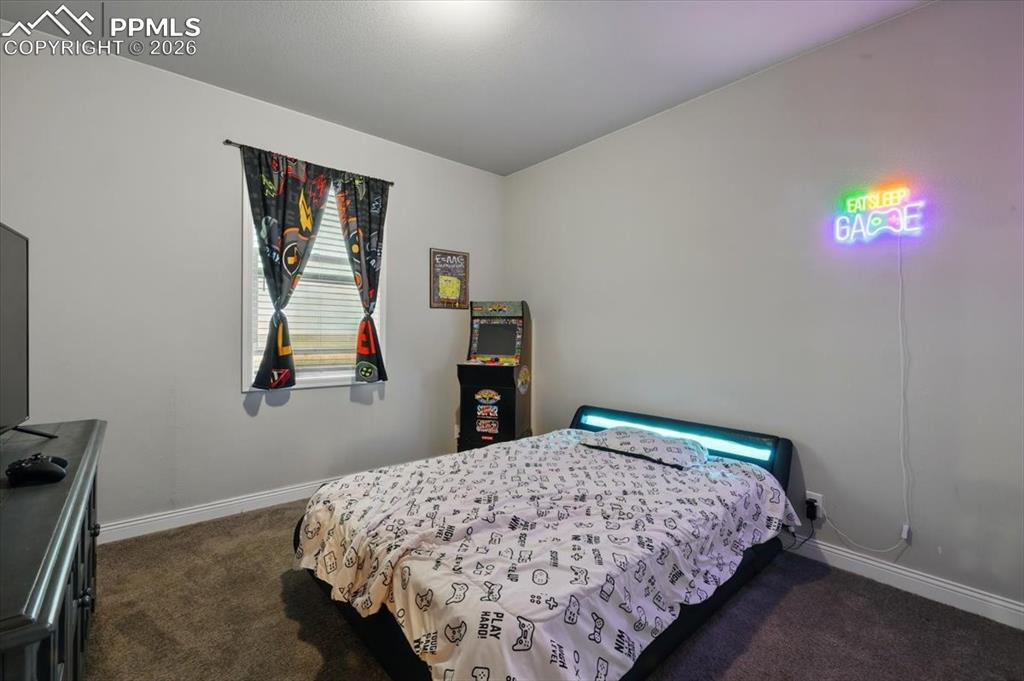 Image 20 of 30: Bedroom featuring carpet flooring and baseboards