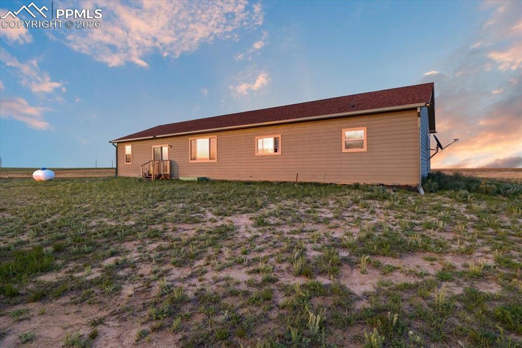 Image 29 of 30: View of property exterior at dusk