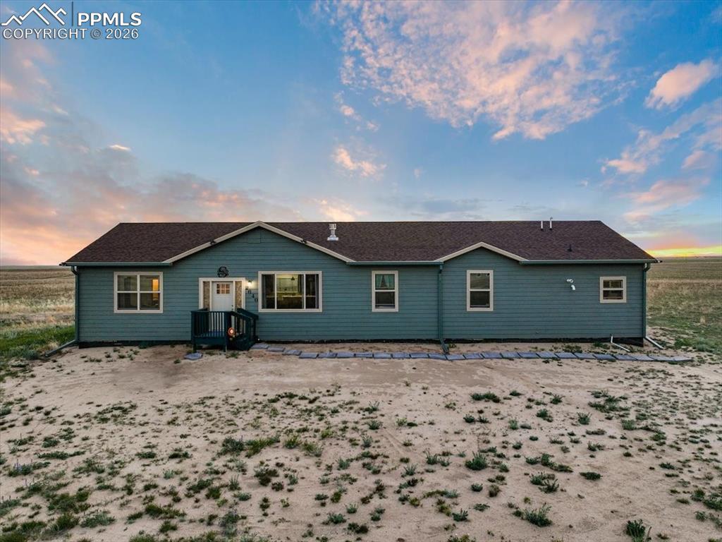 Image 4 of 30: View of back of house at dusk