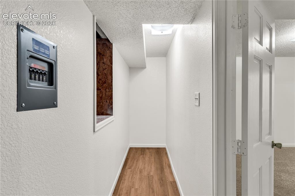 Image 26 of 32: Basement storage to crawl space access
