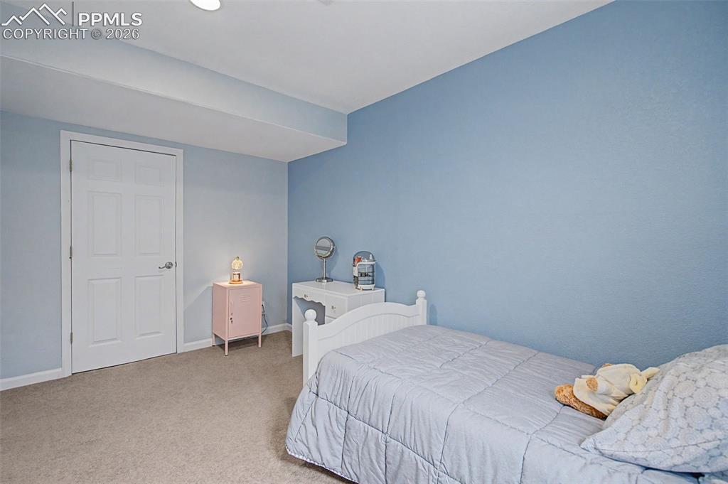 Image 36 of 49: Basement guest room