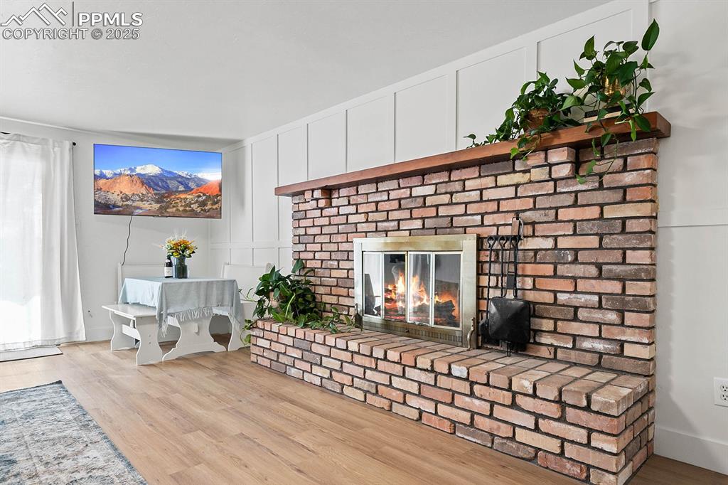 Image 23 of 45: fireplace, and a decorative wall
