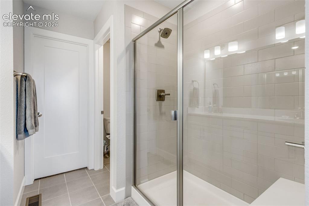 Image 19 of 34: Nice-sized glass shower enclosure.