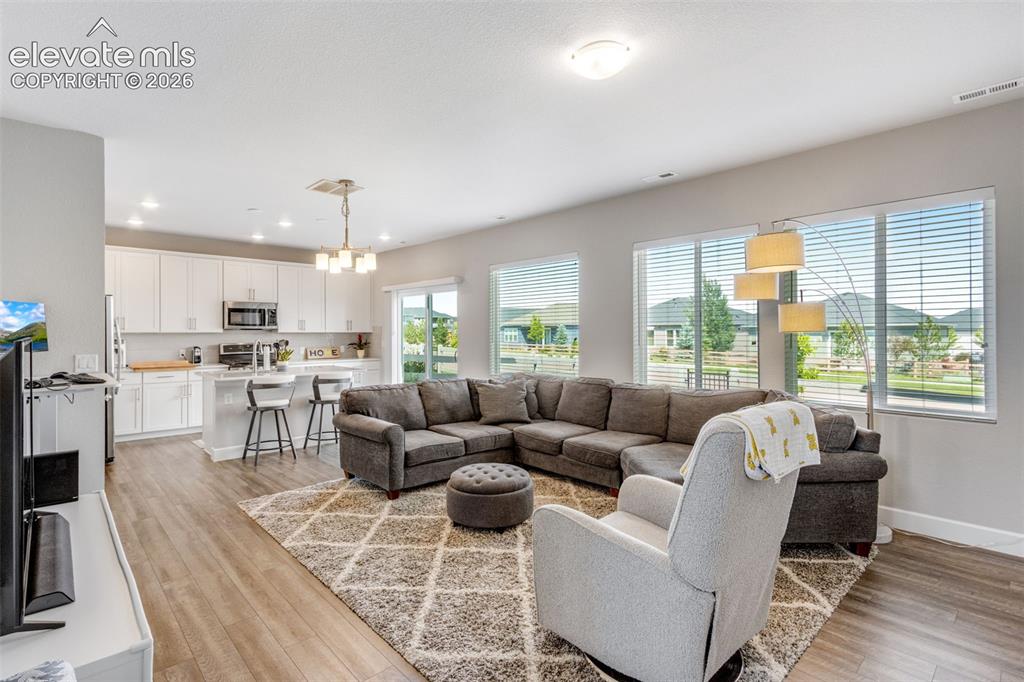 Image 2 of 34: This beautiful Home has an Open Concept Living Room that flows to the Kitch