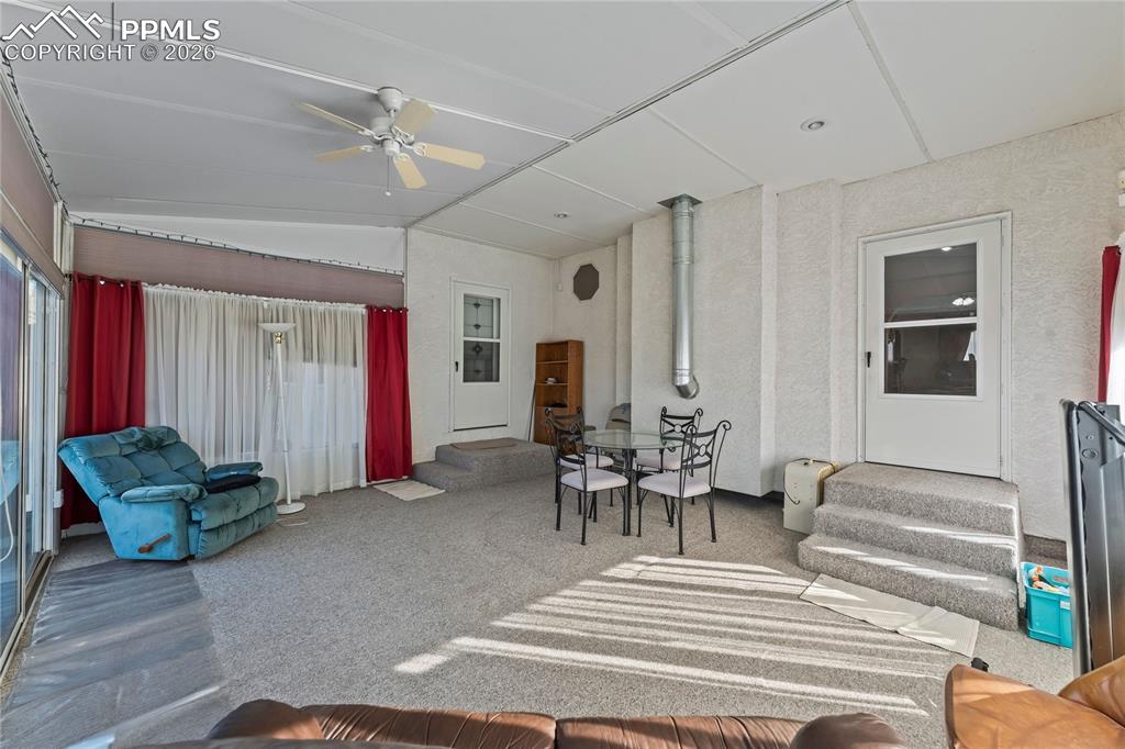 Image 13 of 41: Sunroom featuring lofted ceiling