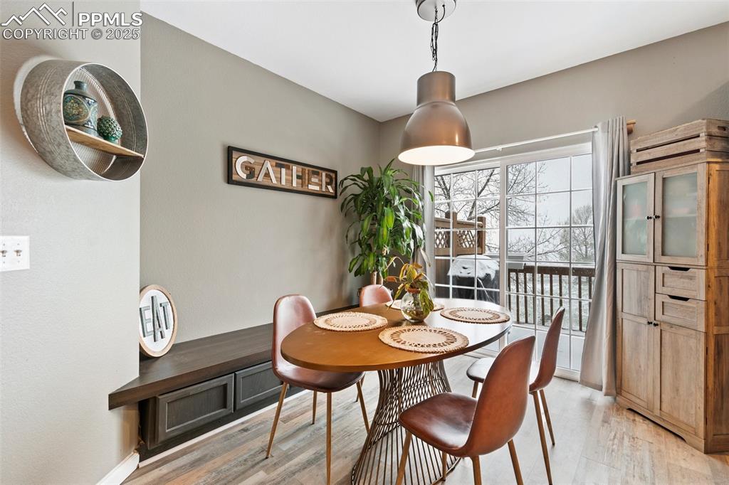 Image 10 of 34: Dining space with light wood-style flooring