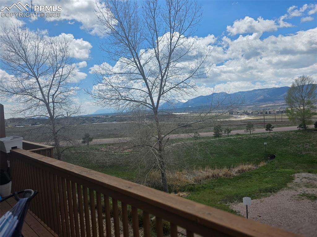 Image 32 of 34: View of mountain backdrop with rural landscape