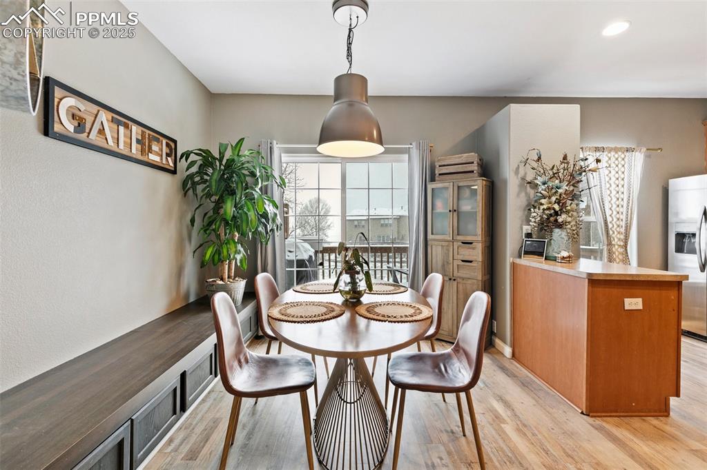 Image 9 of 34: Dining area with light wood-type flooring