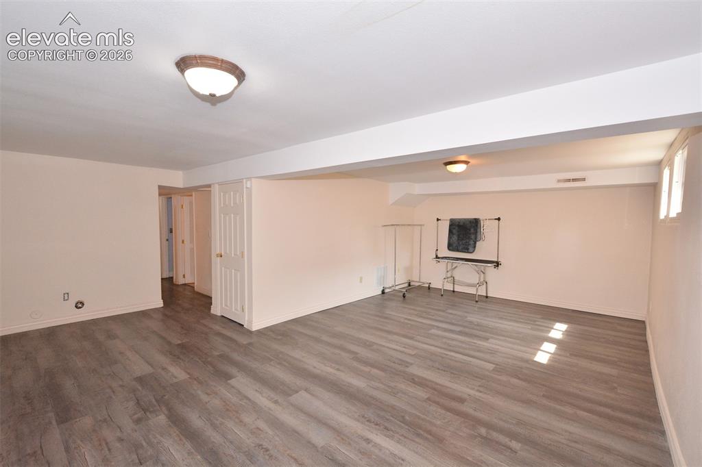 Image 17 of 24: Family room in basement