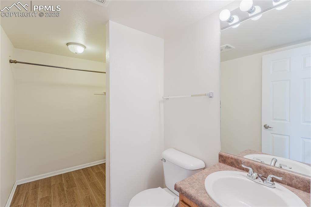 Image 17 of 42: The property features a kitchen with light wood cabinetry, white appliances