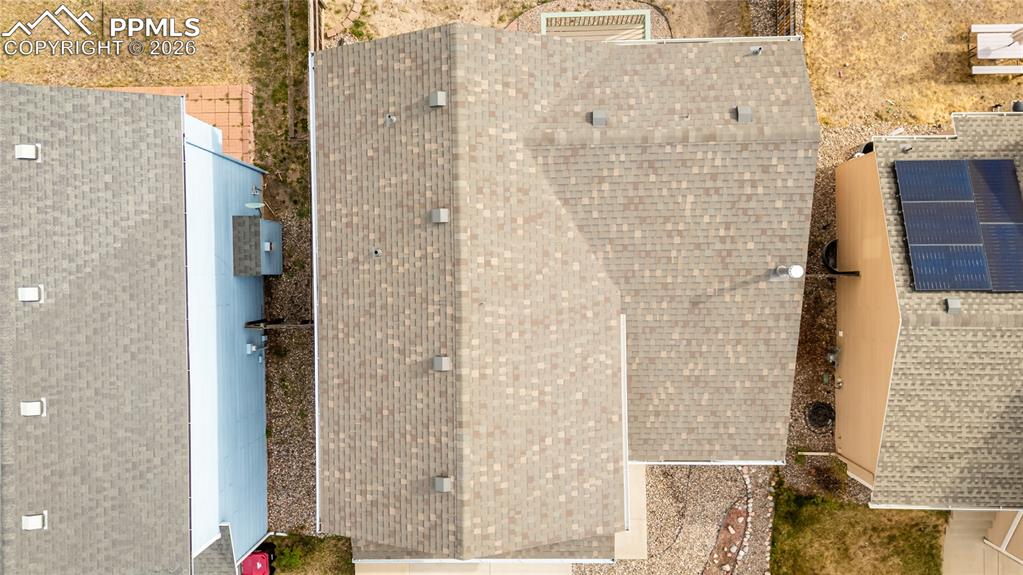 Image 36 of 42: Bathroom vanity featuring a light wood cabinet, white countertop, and an in