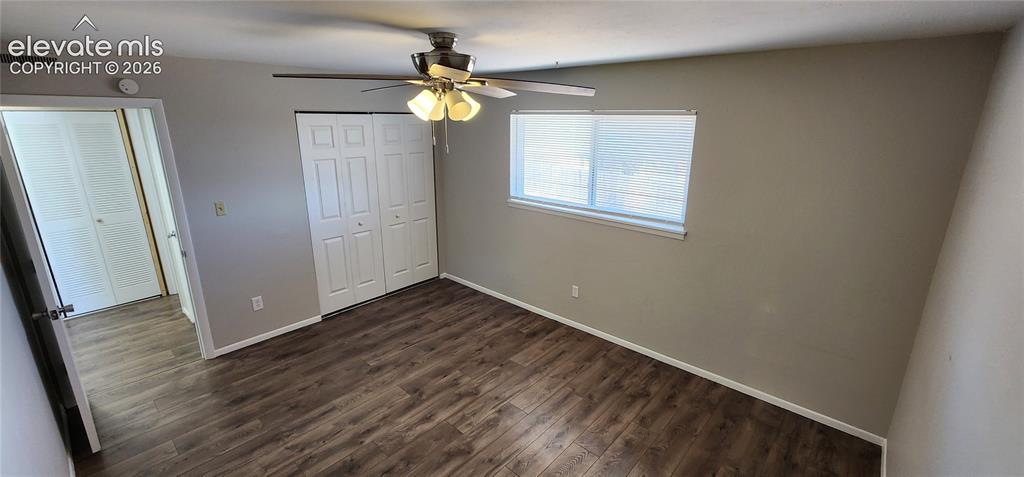 Image 18 of 18: Apt 4 - Wood-finish flooring, ceiling fan with integrated lighting, window