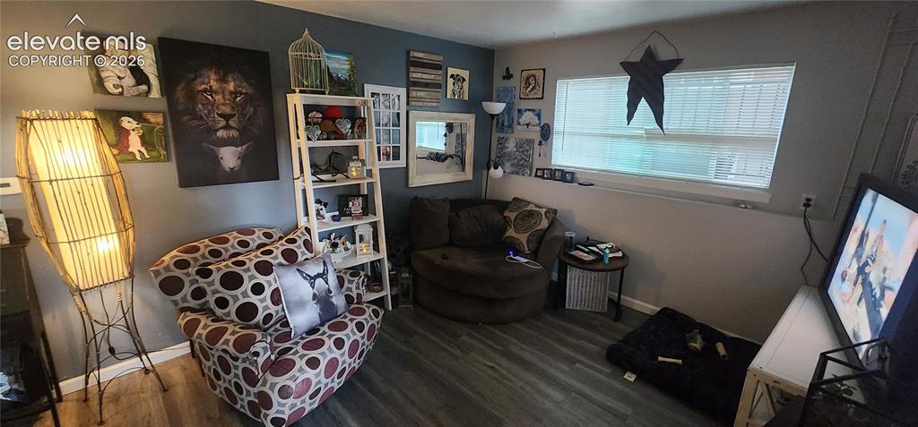 Image 6 of 18: Apt 2 - Wood-finish flooring with a multi-tone wall design