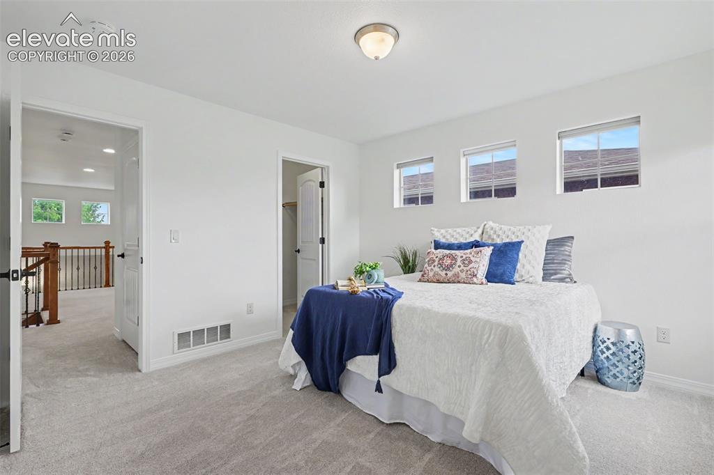Image 18 of 36: Upper level bedroom
