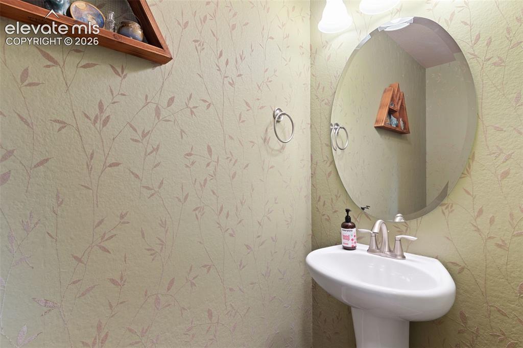 Image 32 of 36: Main level powder room