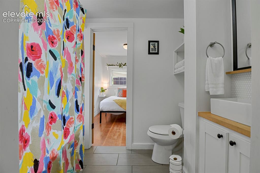 Image 26 of 43: 2nd bathroom with clawfoot tub and shower
