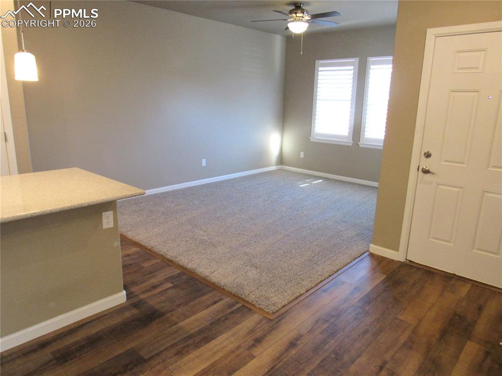Image 9 of 25: Carpeted living room on main level