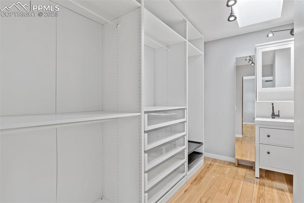 Image 16 of 34: Custom shelving in the primary bath