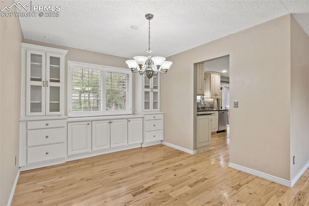Image 7 of 34: Custom built-ins in dining area