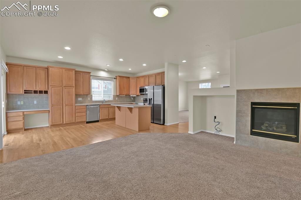 Image 14 of 49: Family room with gas burning fireplace