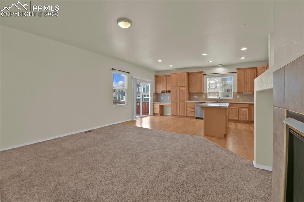 Image 15 of 49: Family room with view to kitchen