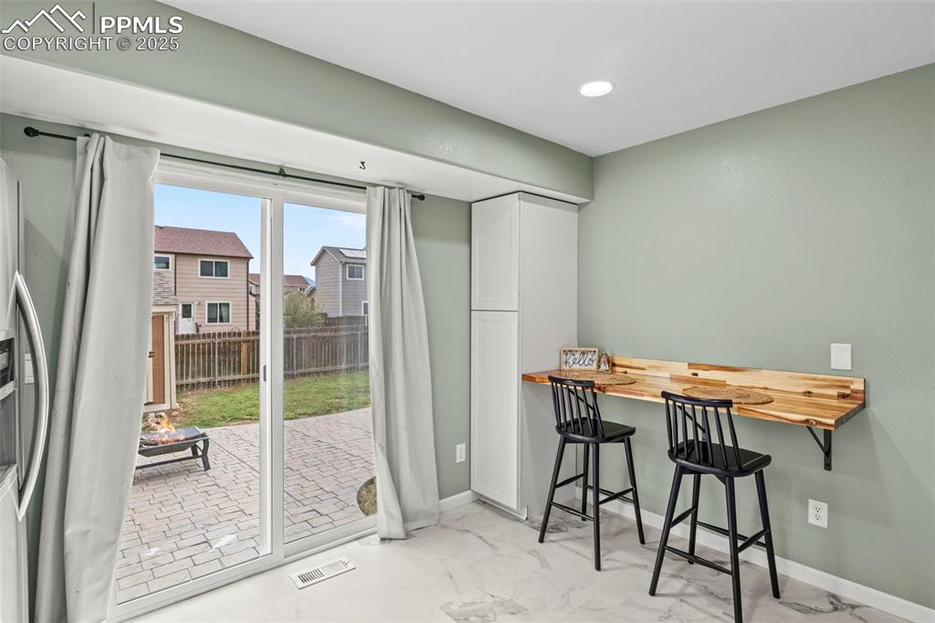 Image 17 of 39: Dining room featuring baseboards