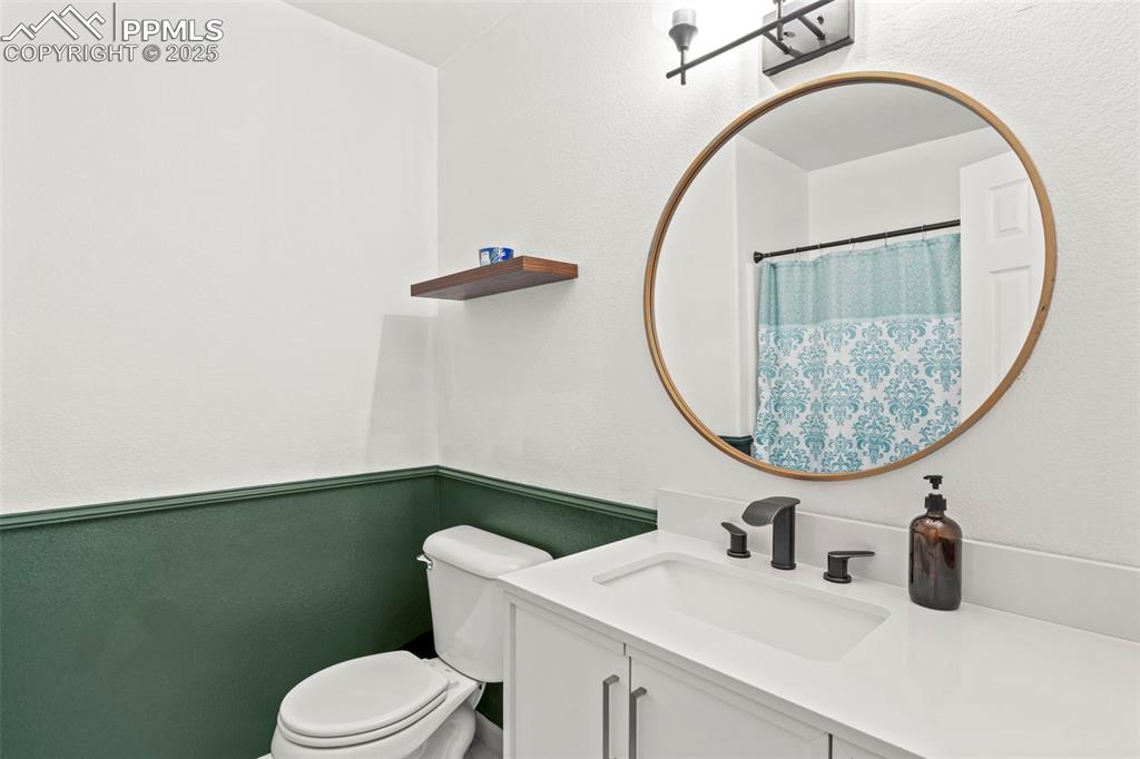 Image 27 of 39: Bathroom featuring vanity and toilet