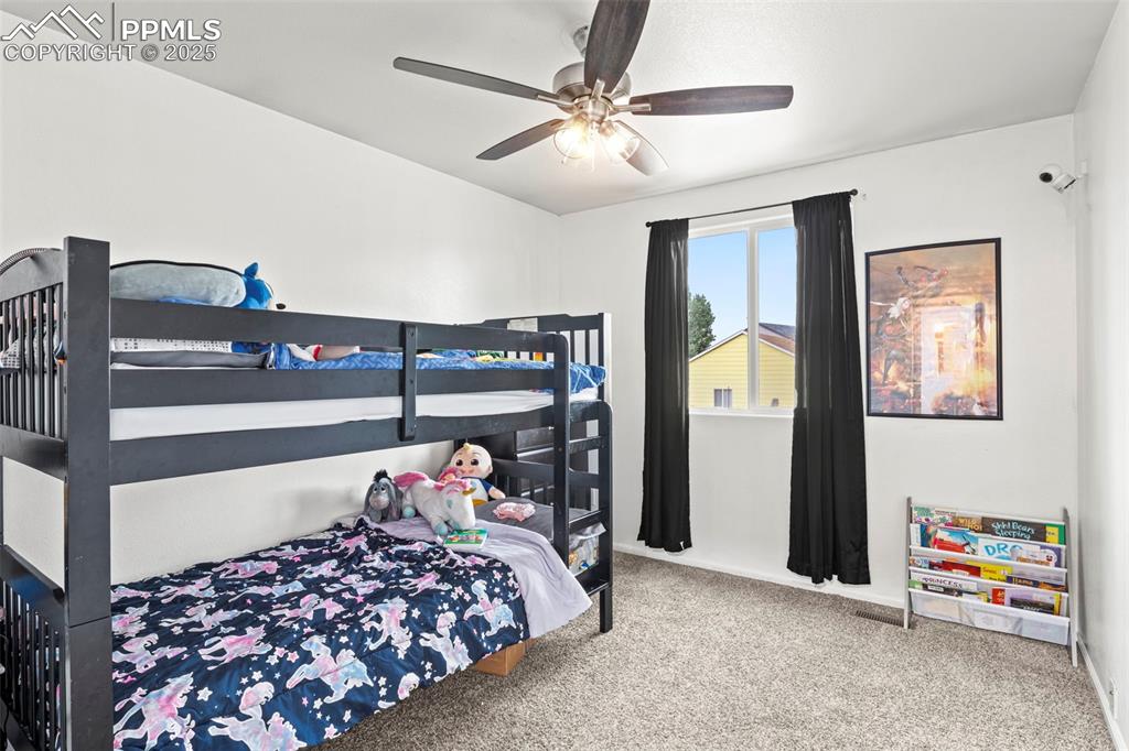 Image 30 of 39: Bedroom featuring carpet flooring and ceiling fan