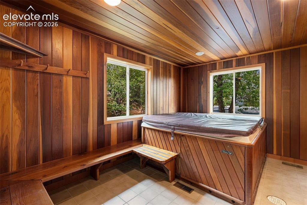 Image 18 of 49: Hot tub room at the back of the house.
