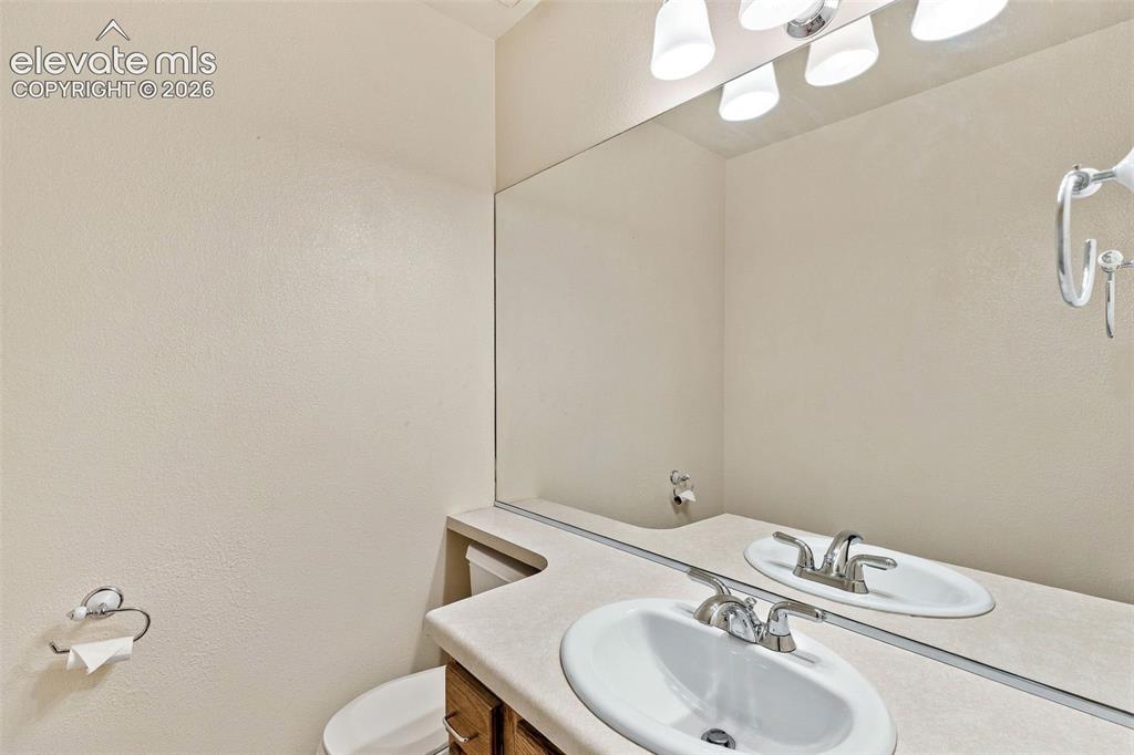 Image 21 of 49: Main level half bath.