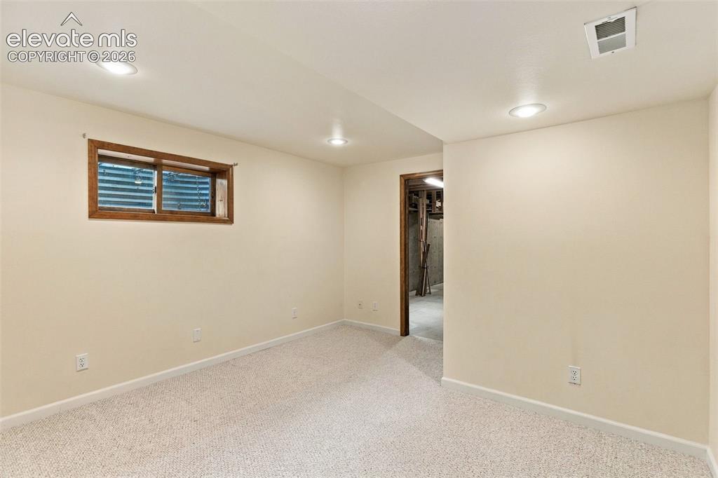 Image 35 of 49: Basement office space.