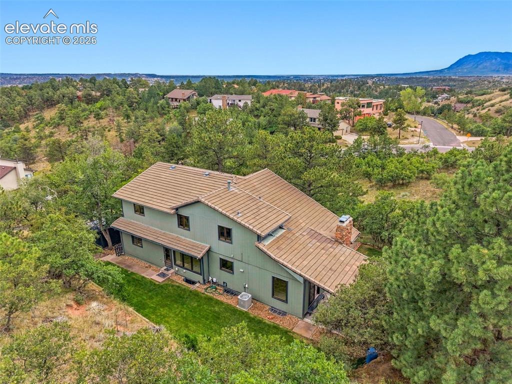 Image 42 of 49: Concrete tile roof and low maintenance lot.