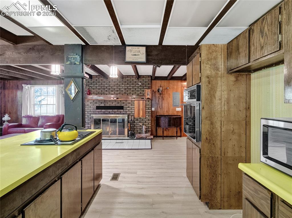 Image 11 of 49: Nice open area to Living room and dining room, the cook can always be a par