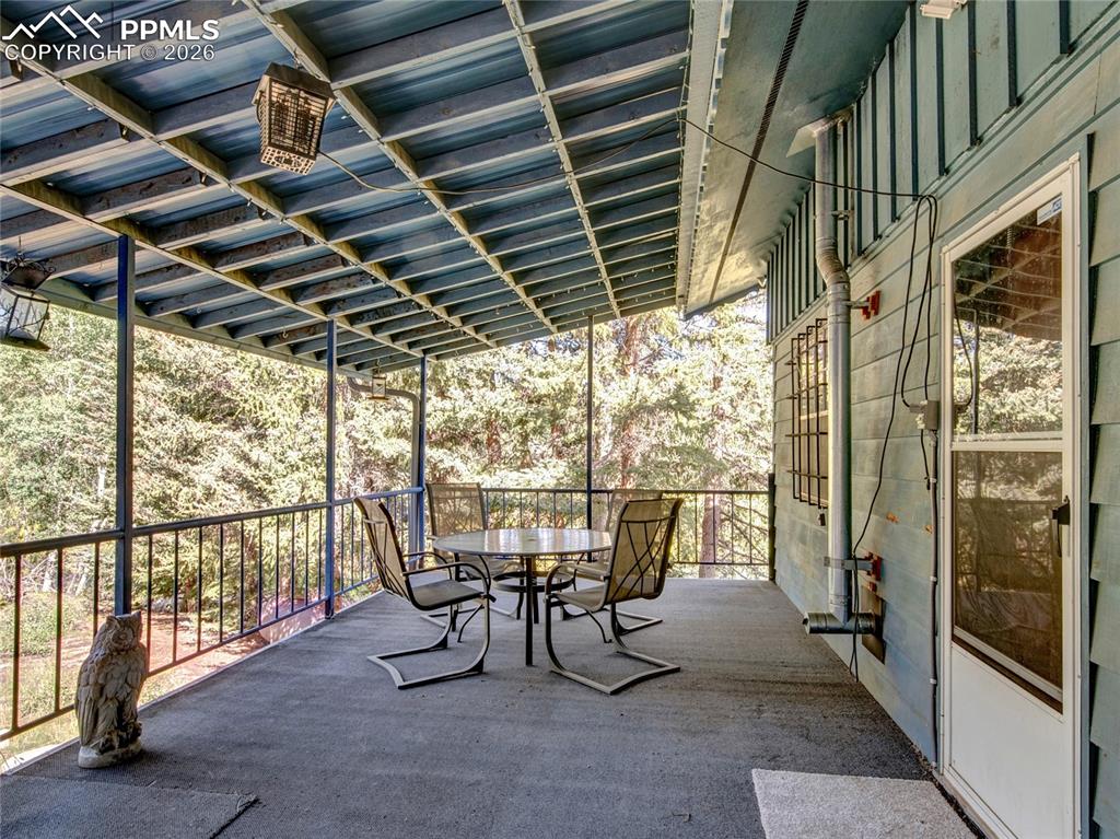 Image 23 of 49: Very private deck off of the kitchen for easy BBQ and quite relaxing