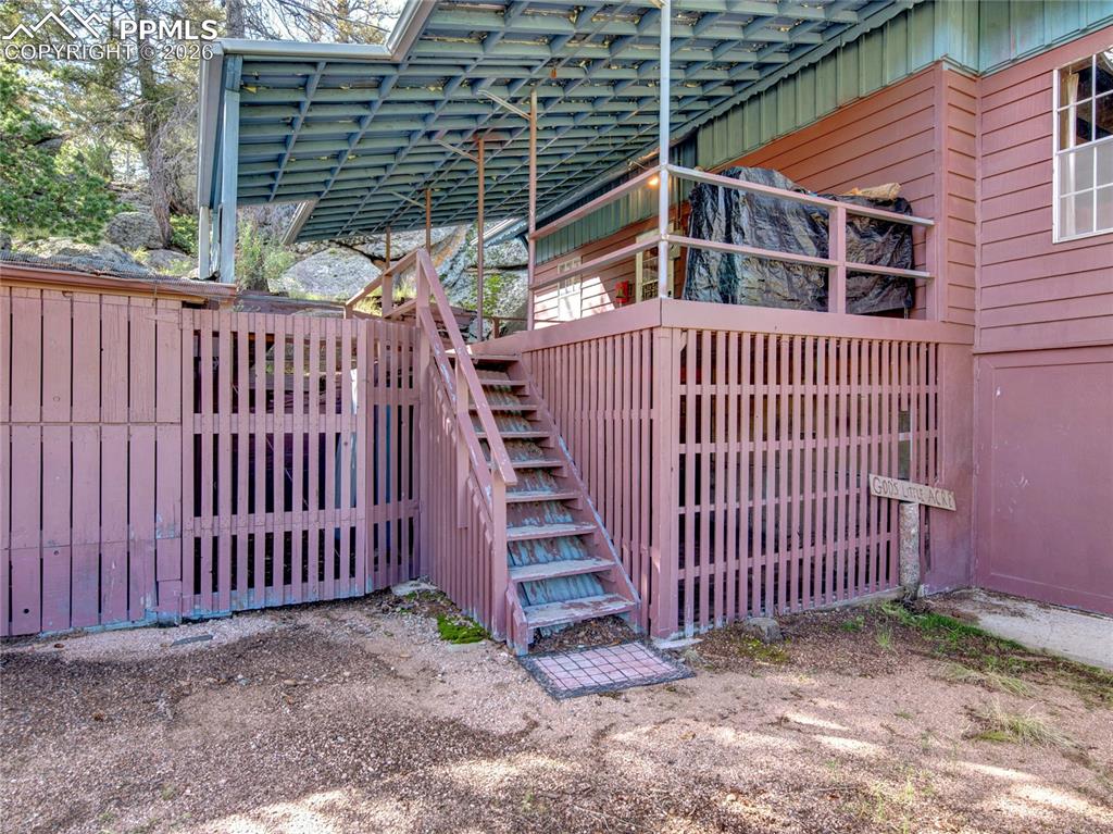 Image 3 of 49: Entry to the front door with another wonderful covered deck