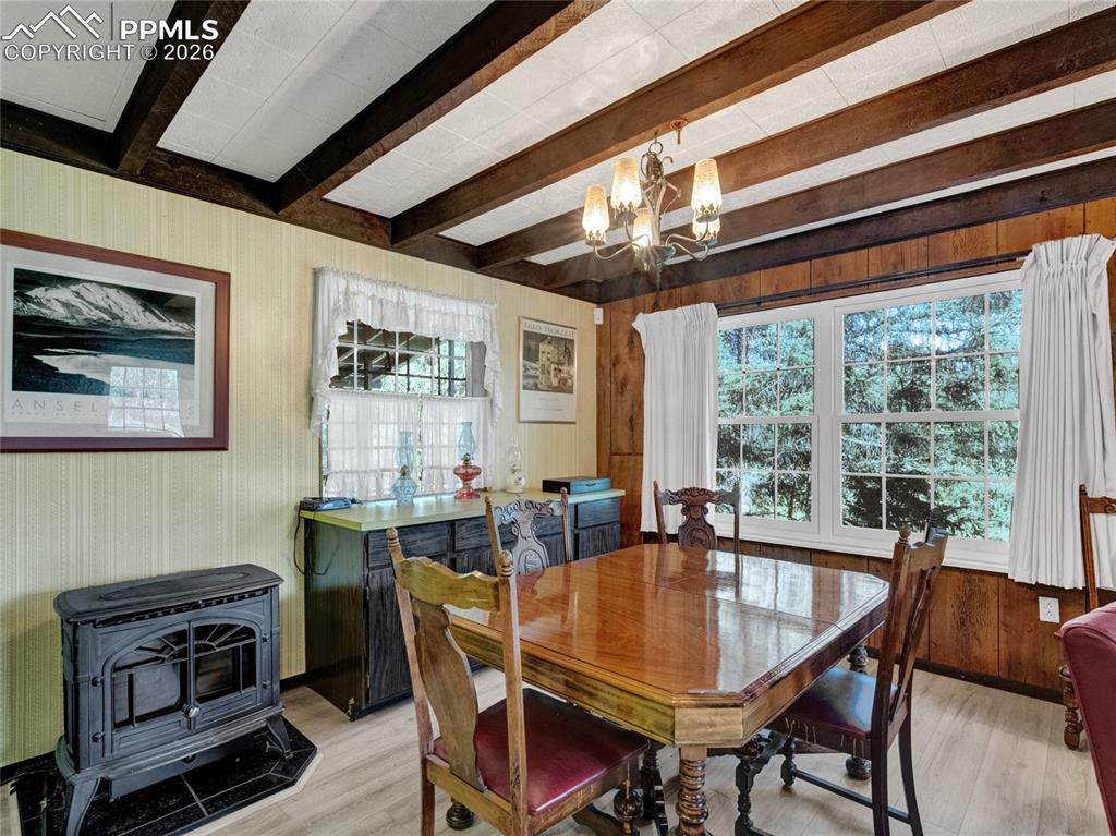 Image 9 of 49: Nice open and bright dining area with an electric stove