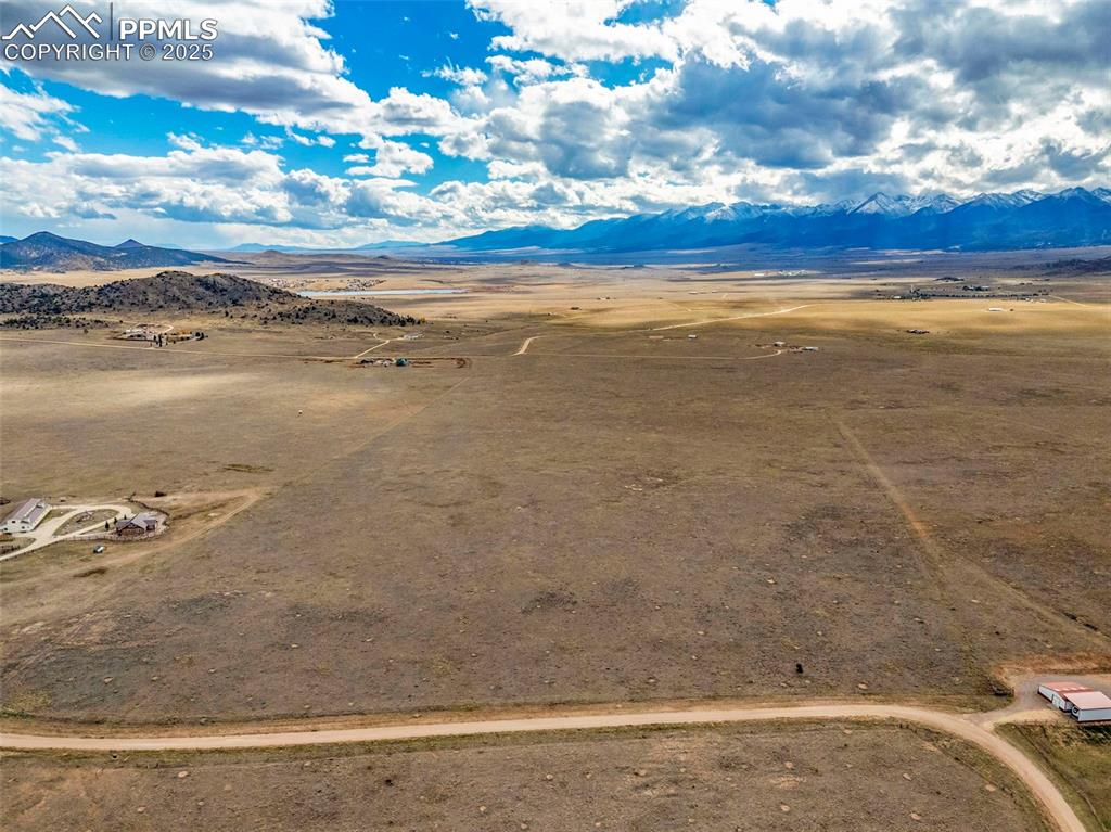 Image 10 of 14: View of rural area featuring a desert landscape and mountains