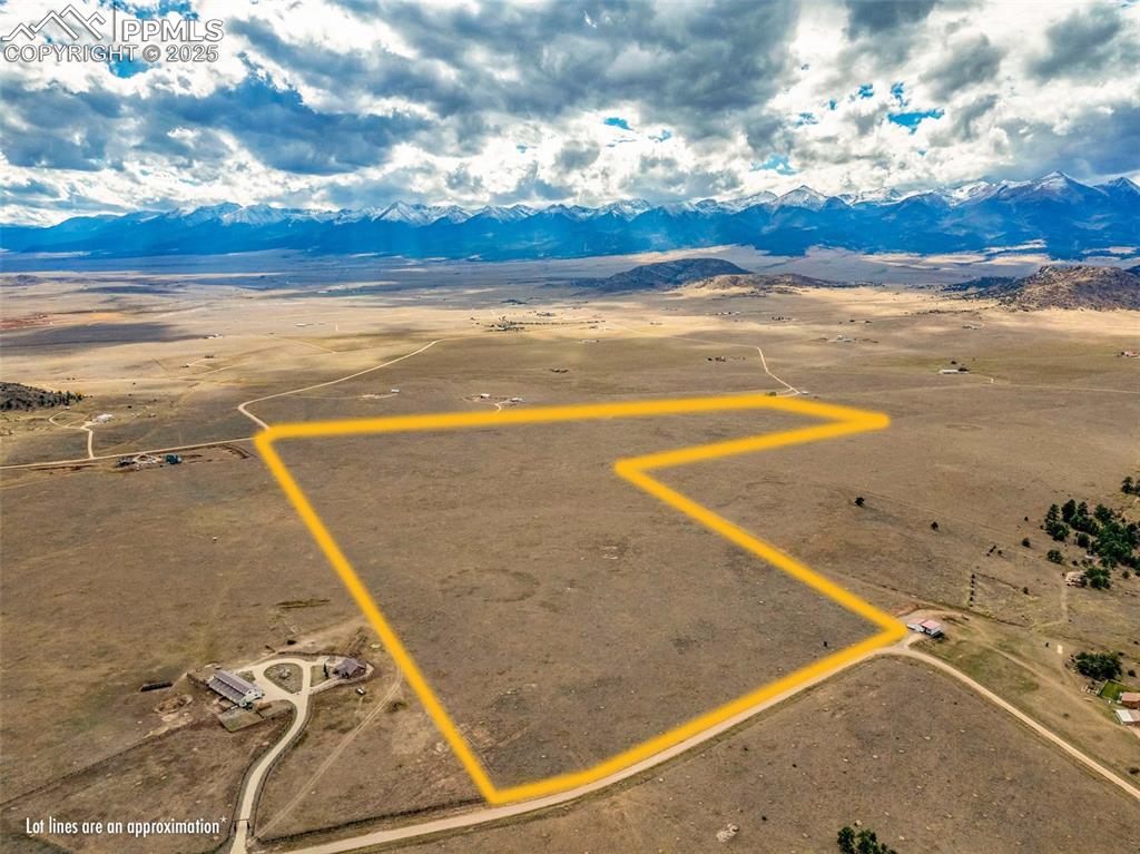 Image 14 of 14: Overview of rural landscape with property. Property lines are approximate a