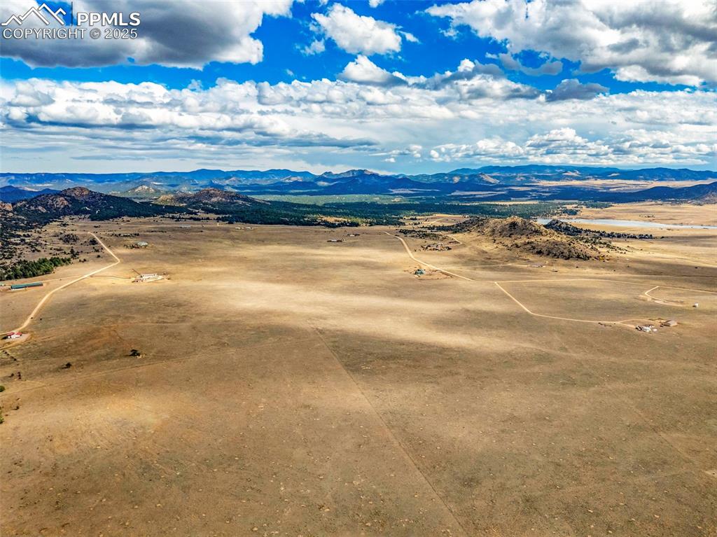 Image 8 of 14: Aerial view of sparsely populated area featuring mountains