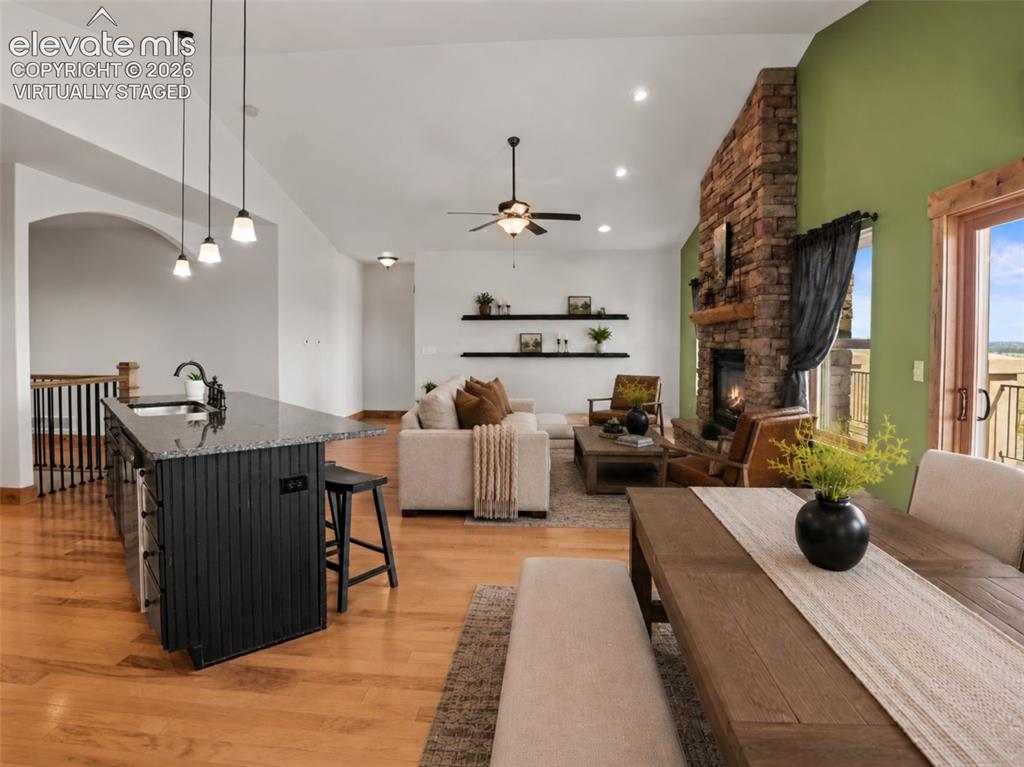 Image 11 of 50: open-concept main level. virtually staged
