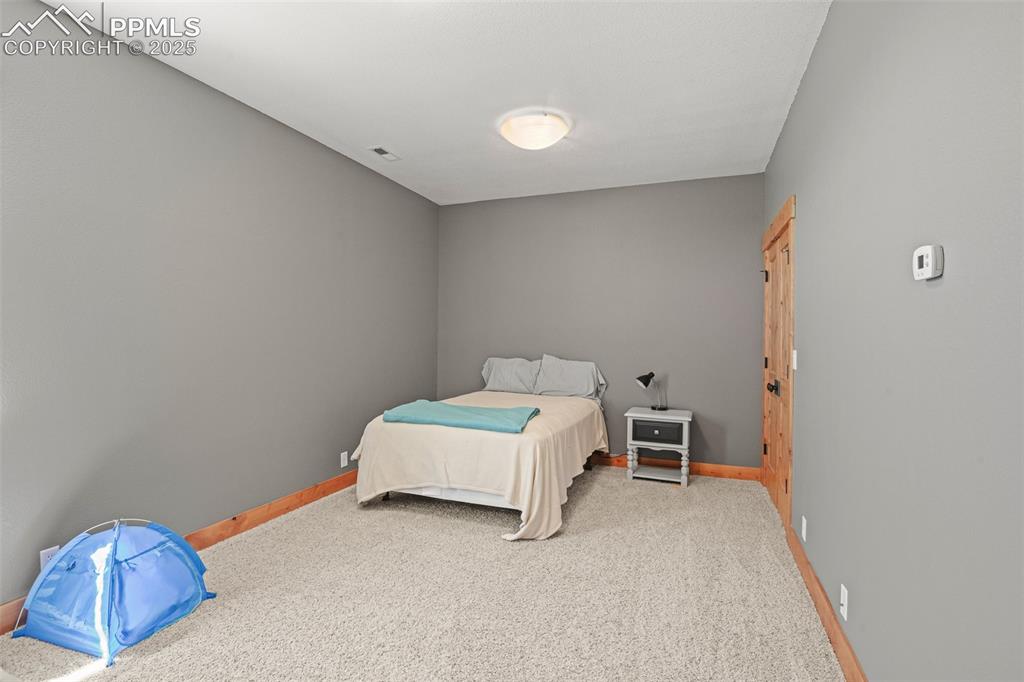 Image 34 of 50: lower 3rd bedroom